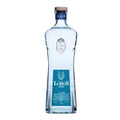 A bottle of Lobos 1707 Joven Tequila, co-founded by LeBron James, stands on a rustic wooden surface. The clear bottle showcases the tequila's light color, a result of its unique blend and finishing in sherry barrels using the Solera method.
